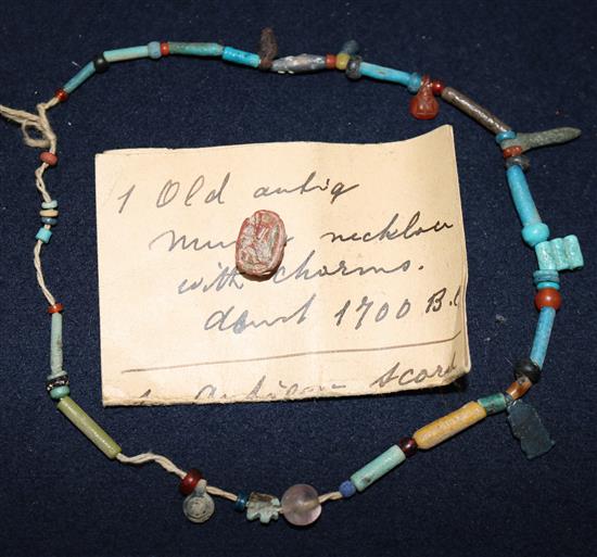 An ancient Egyptian charm necklace.